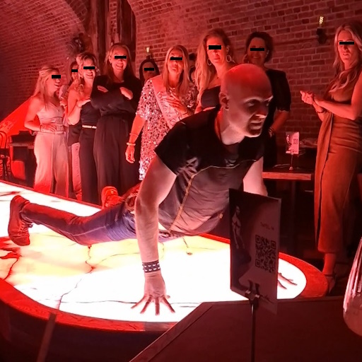 PlayMale performing lap dance moves on the illuminated raised plateau in a ladies only club